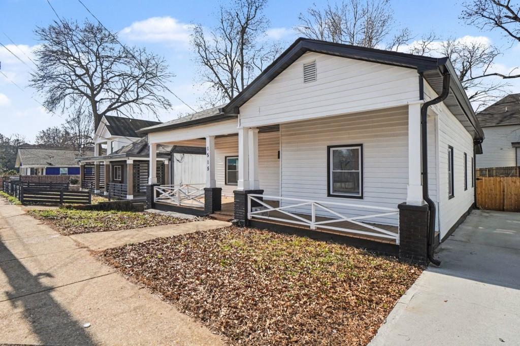 1515 Jonesboro Road Southeast Atlanta, GA 30315 - Photo 7 of 32 a front view of a house with garden
