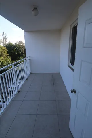 a room with gym equipment and mirror