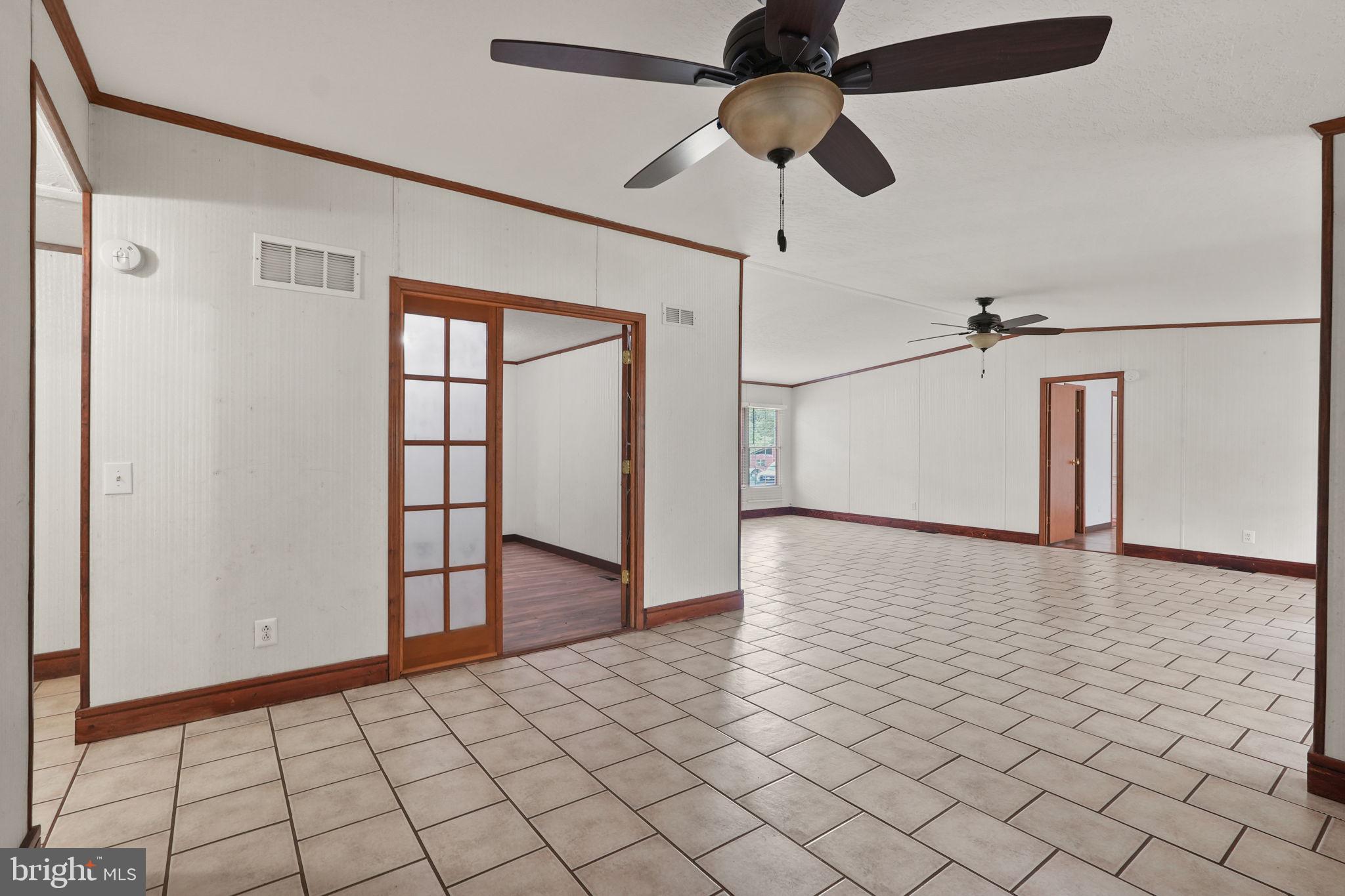 4901 Lewiston Road Bumpass, VA 23024 - Photo 16 of 42 Living room and entrance to bedroom / french doors