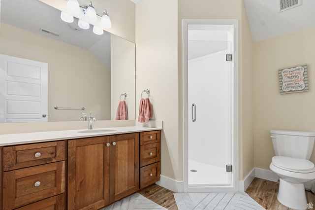 672 Perry Hollow Drive Mapleton, UT 84664 - Photo 65 of 106 Bathroom featuring a vanity with wood cabinetry, a light-toned countertop, and an integrated sink with a chrome faucet