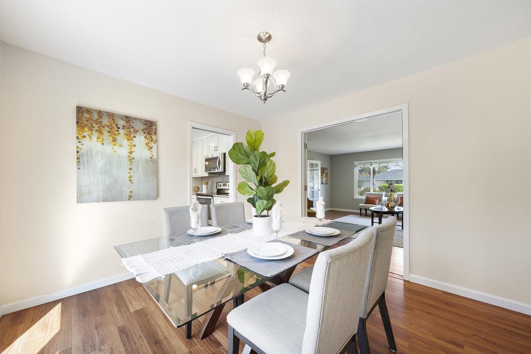 535 Hyde Park Drive San Jose, CA 95136 - Photo 11 of 28 a view of a dining room with furniture wooden floor and chandelier