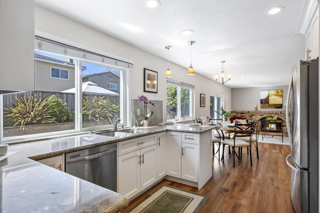535 Hyde Park Drive San Jose, CA 95136 - Photo 4 of 28 a kitchen with a sink stove and cabinets