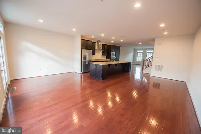 a view of kitchen and a wooden floor