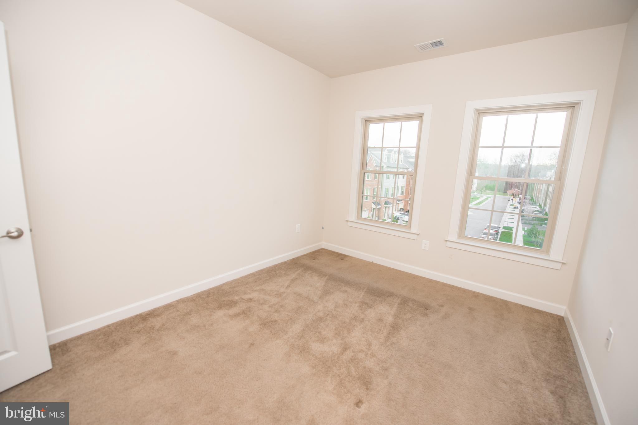 7444 Burnside Way Hanover, MD 21076 - Photo 31 of 46 an empty room with windows