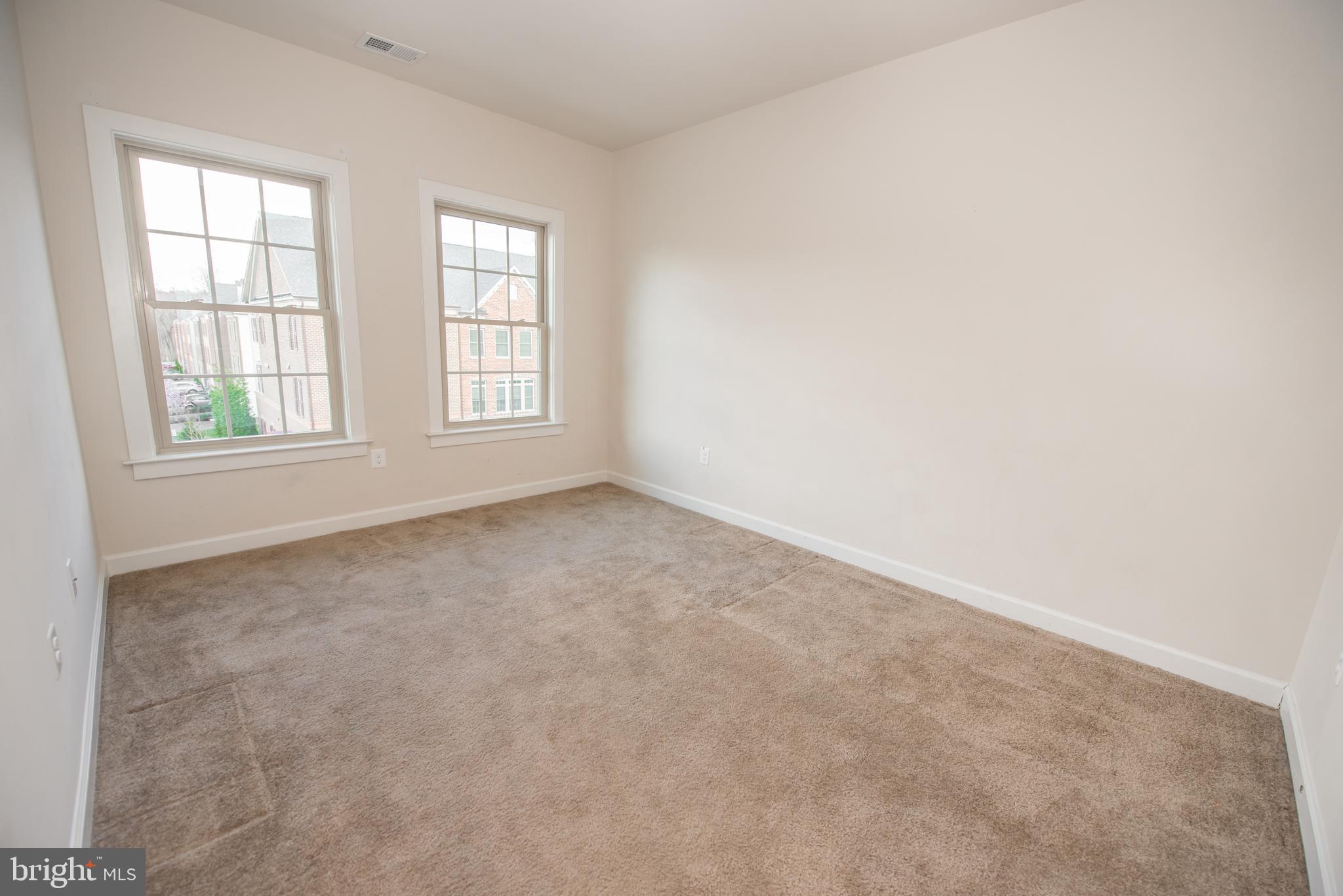 7444 Burnside Way Hanover, MD 21076 - Photo 32 of 46 an empty room with windows