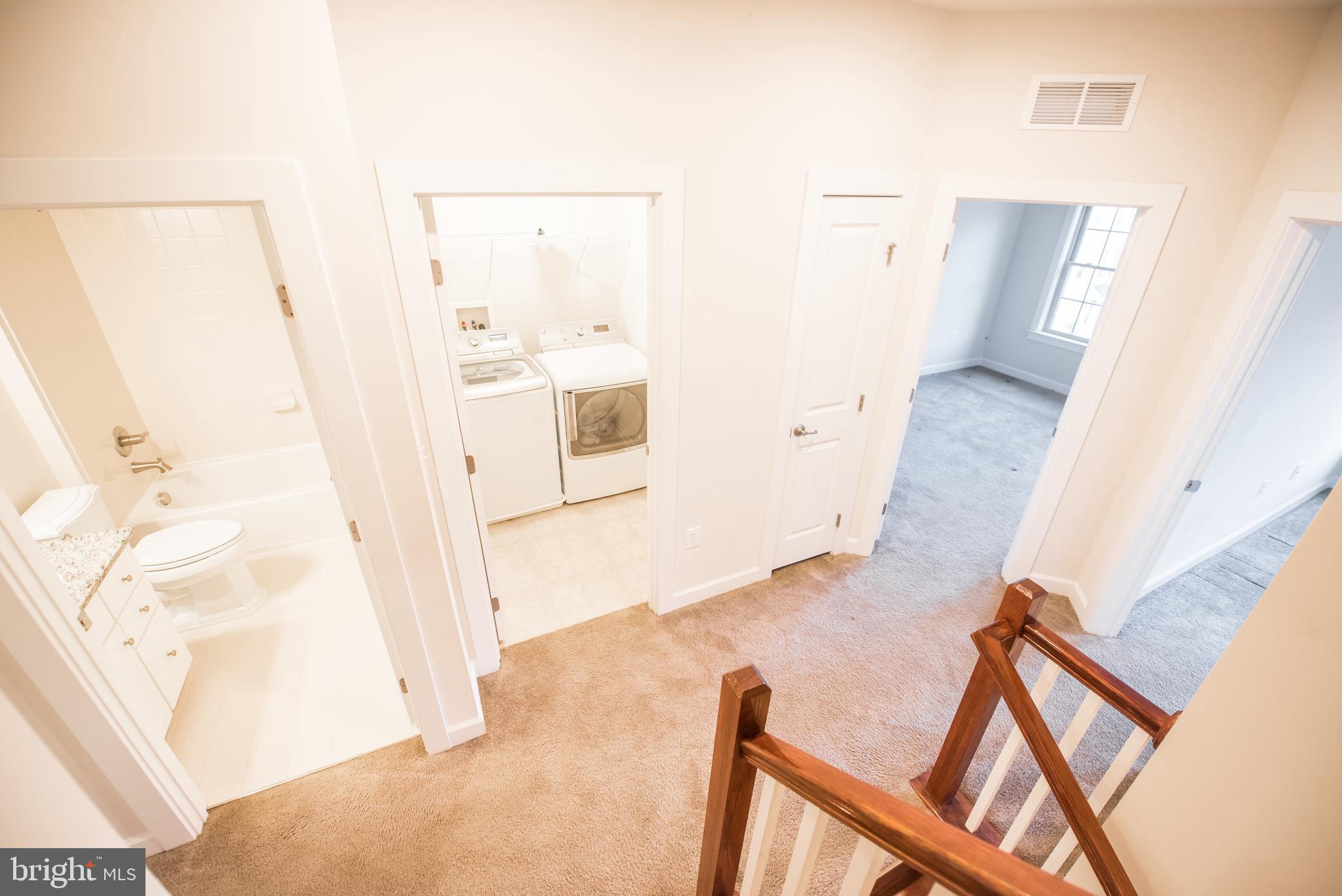 7444 Burnside Way Hanover, MD 21076 - Photo 36 of 46 a view of a living room with furniture and wooden floor