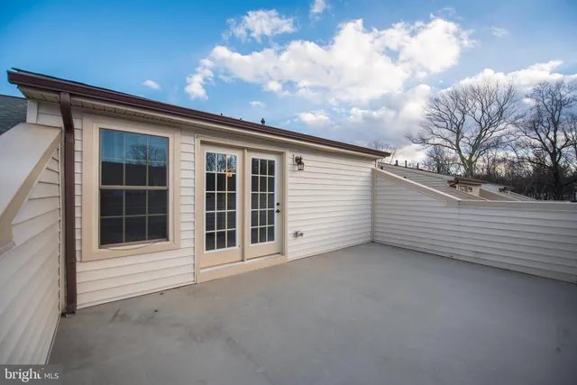 a view of an empty room with a balcony