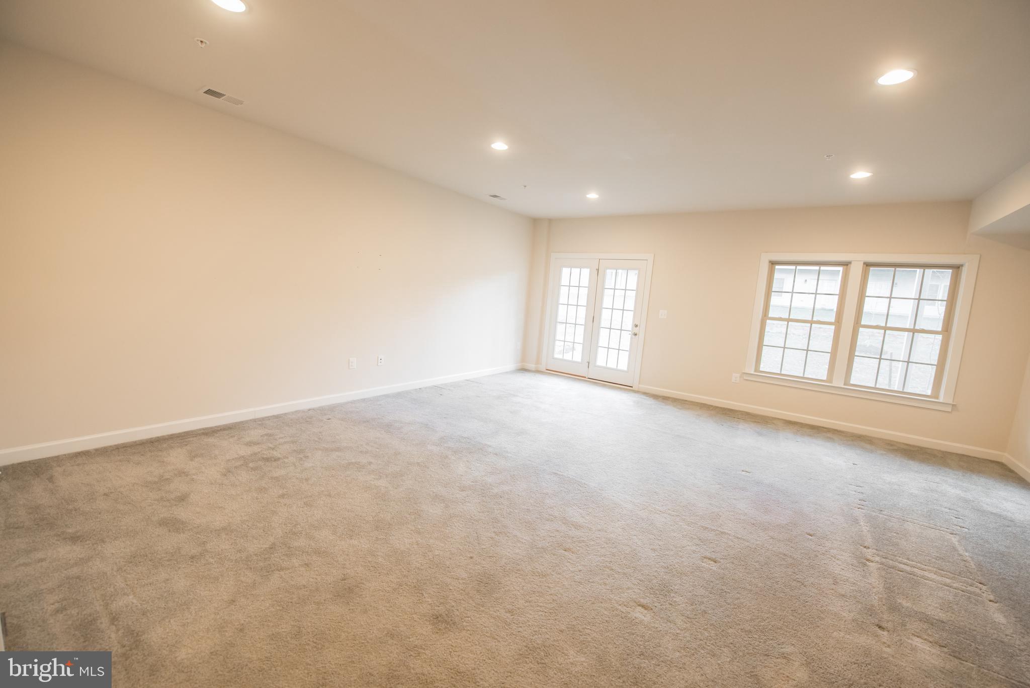 7444 Burnside Way Hanover, MD 21076 - Photo 44 of 46 an empty room with windows