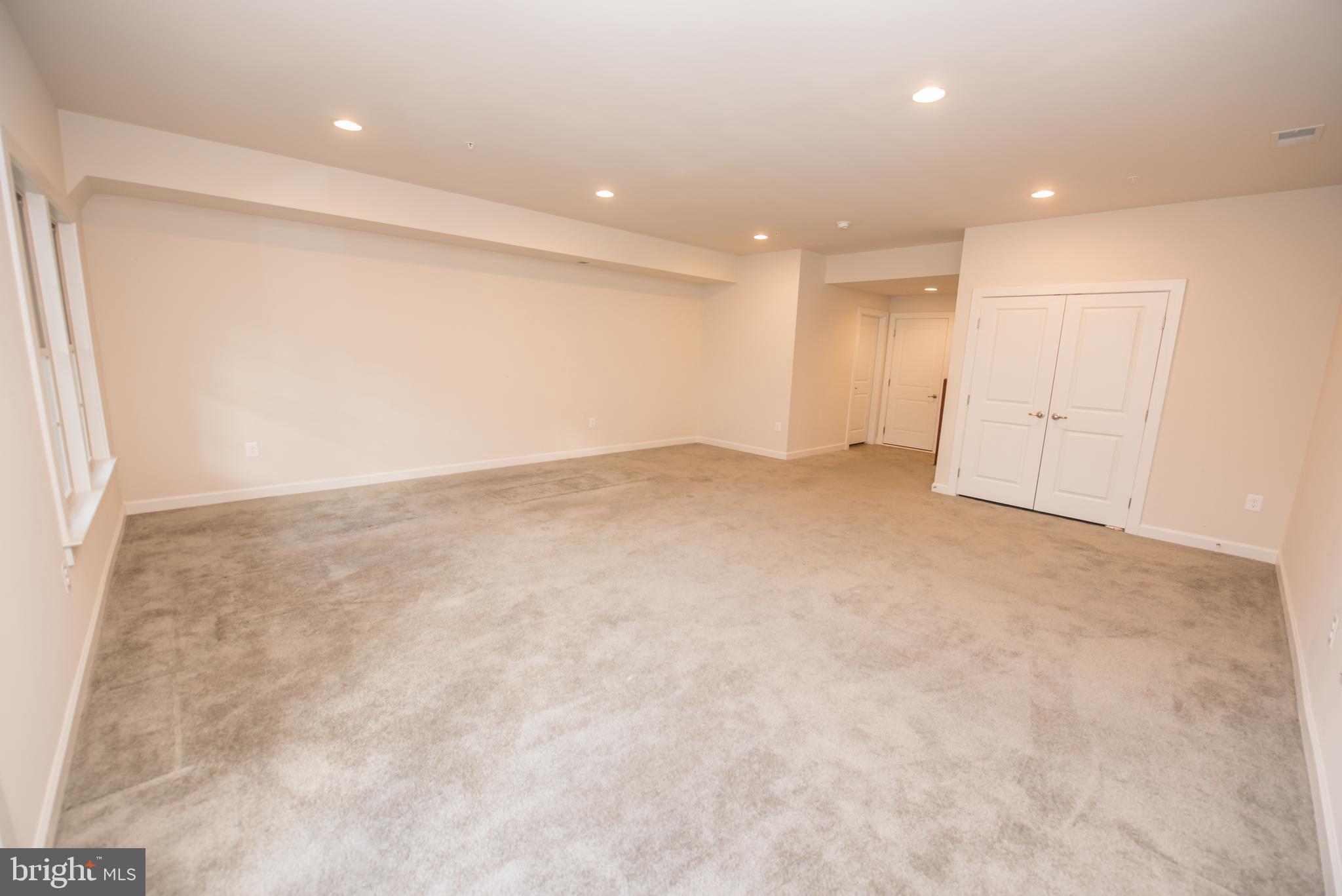 7444 Burnside Way Hanover, MD 21076 - Photo 46 of 46 an empty room with an entryway