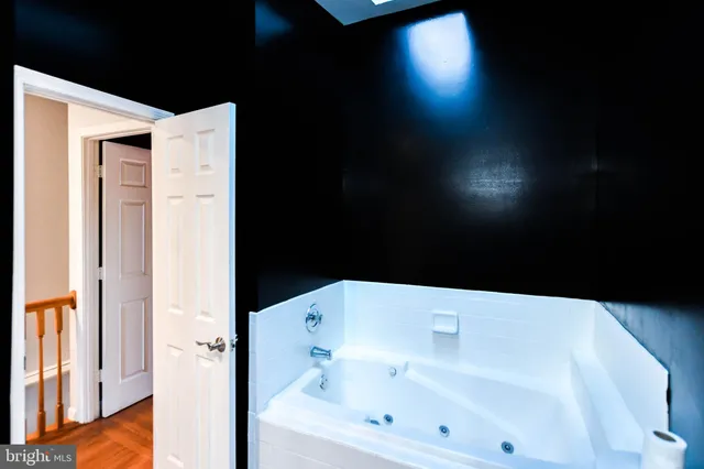 a bathroom with a bathtub and a sink