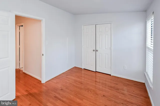an empty room with wooden floor