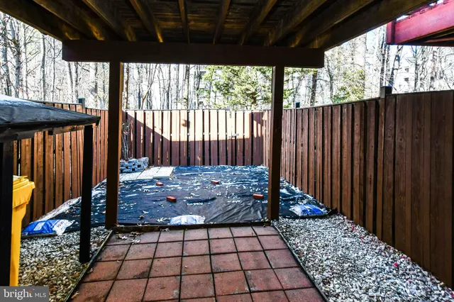 a view of a porch with wooden floor