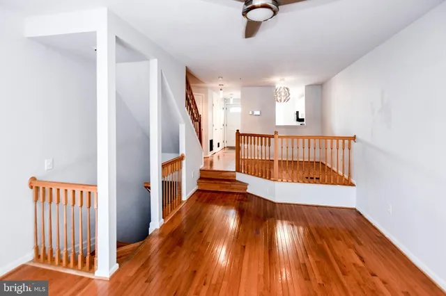 a view of an entryway with wooden floor