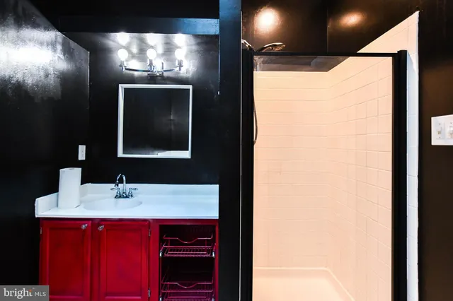 a bathroom with a sink and a mirror