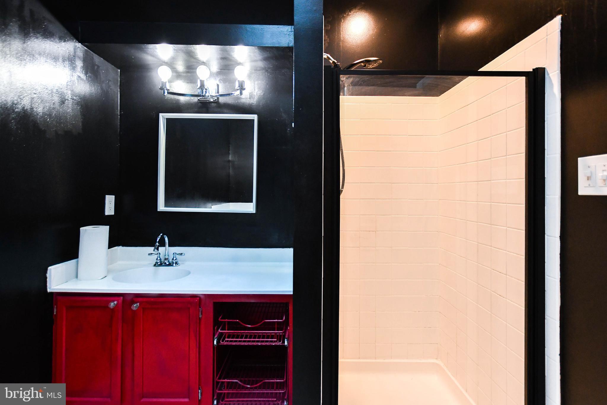 120 Forests Edge Place Laurel, MD 20724 - Photo 10 of 23 a bathroom with a sink and a mirror