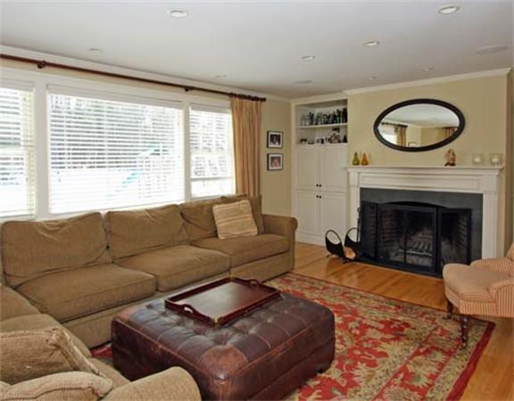 35 Pinecroft Road Weston, MA 02493 - Photo 2 of 17 a living room with furniture a large window and a fireplace
