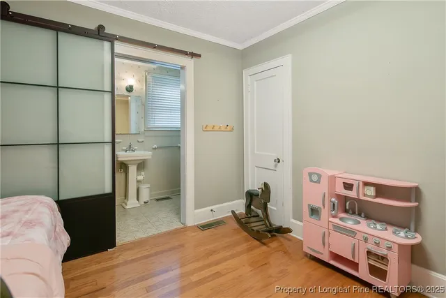 a bedroom with a bed and a dresser