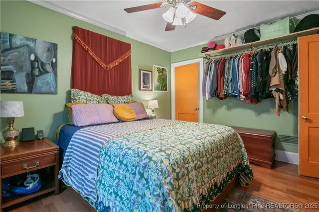 a bedroom with a bed and a closet