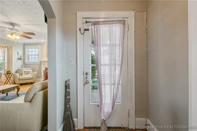 view of living room with furniture and a window