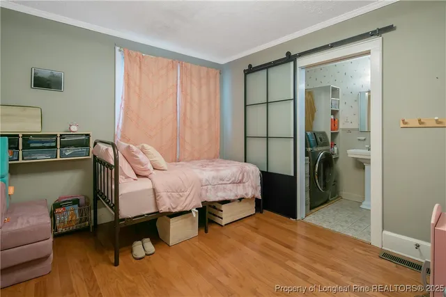 a bedroom with a bed and a chair