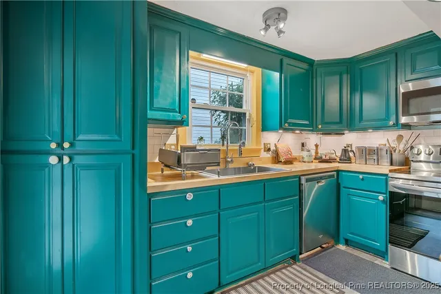 a kitchen with a sink and cabinets