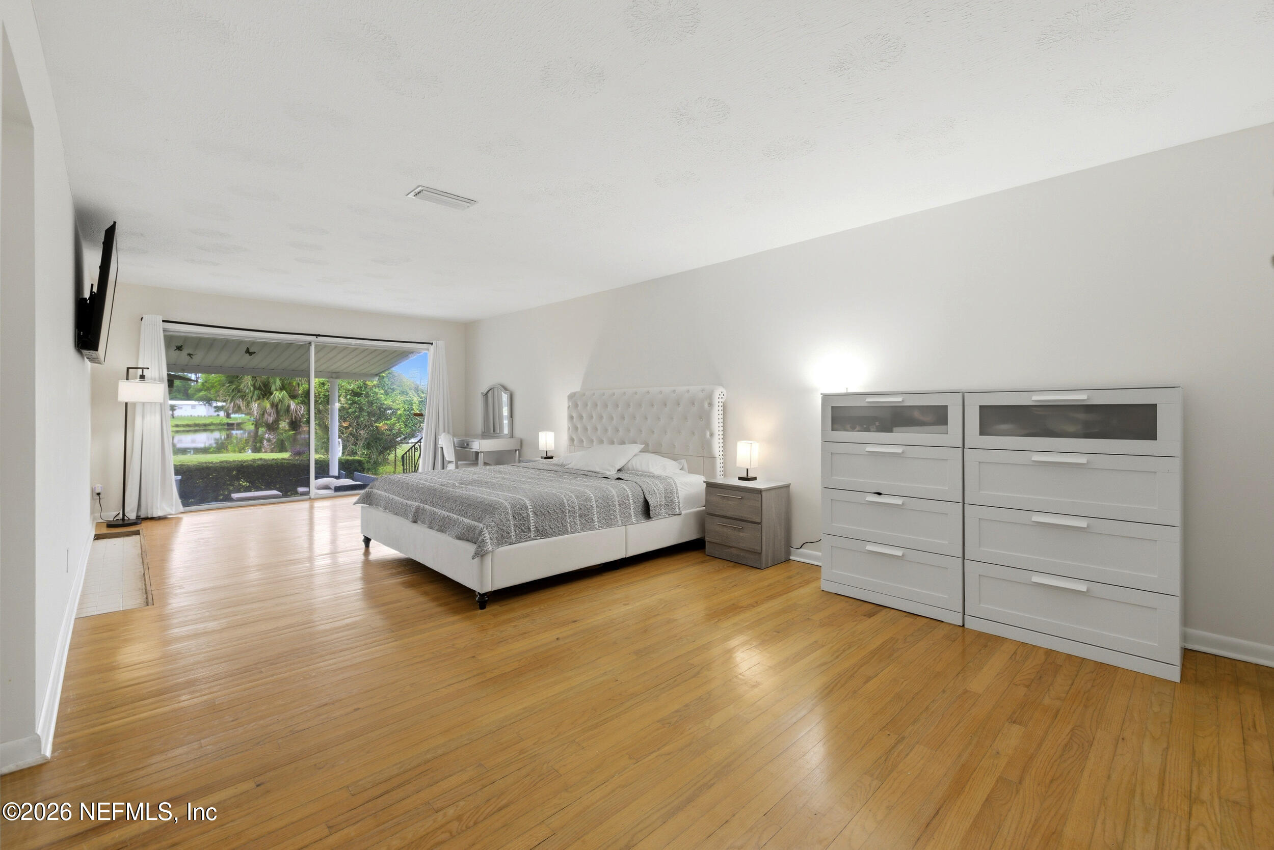 7484 Spinola Road Jacksonville, FL 32217 - Photo 27 of 63 a bedroom with a bed and a window