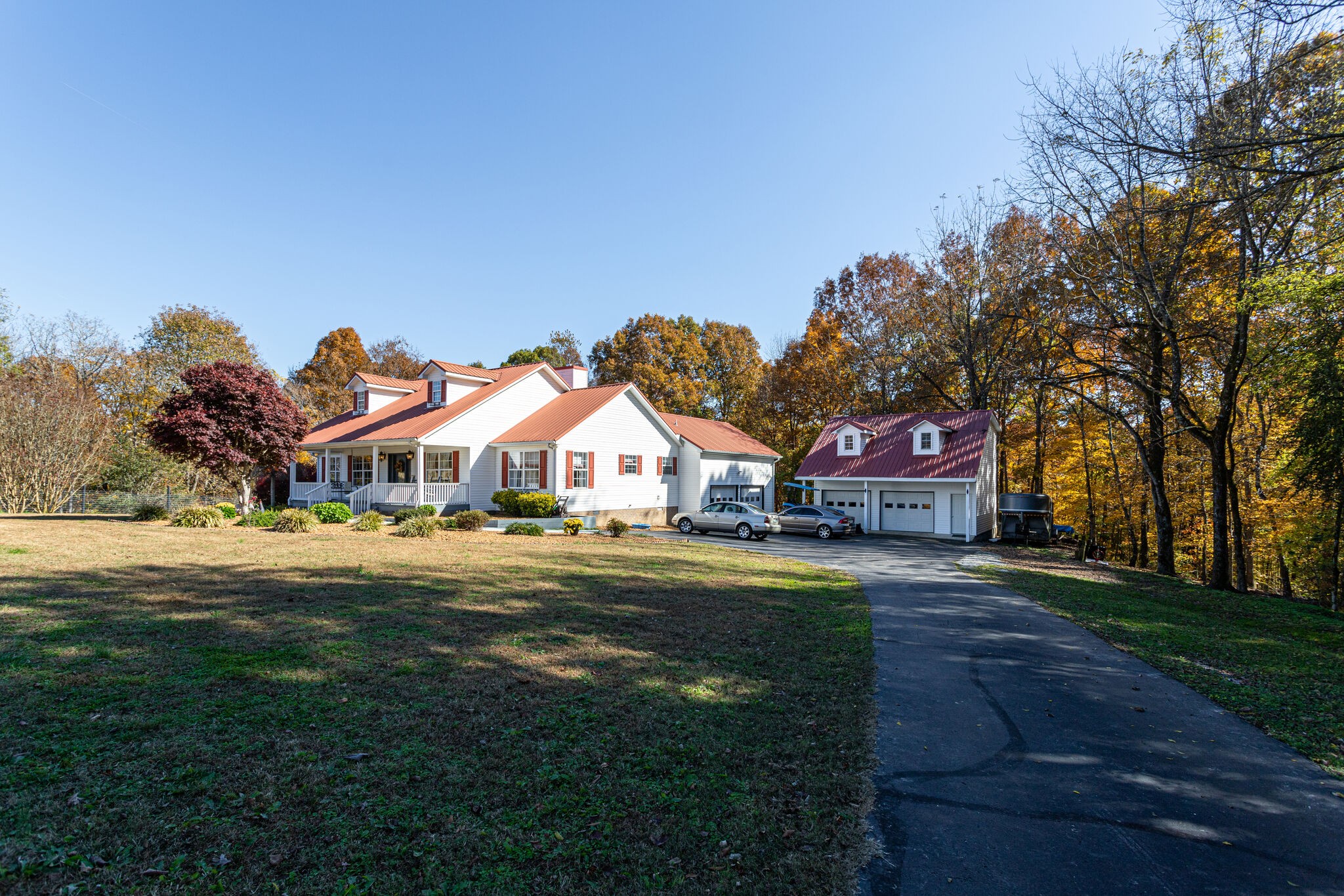 1257 Lyndell Bell Road Manchester, TN 37355 - Photo 4 of 50 a front view of a house with a big yard and a large tree