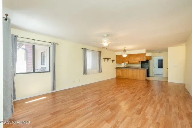 a view of a kitchen with wooden floor