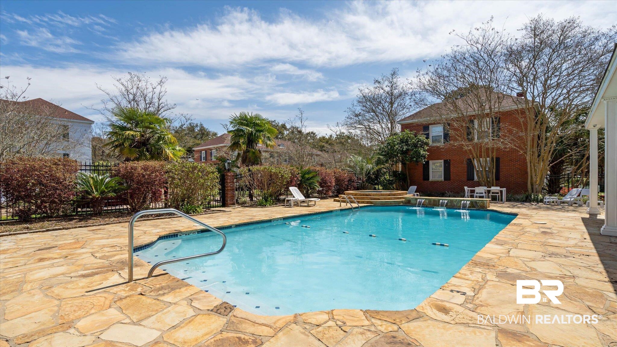 214 Upham Street, Unit 18C Mobile, AL 36607 - Photo 30 of 35 View of swimming pool featuring a patio area and fence