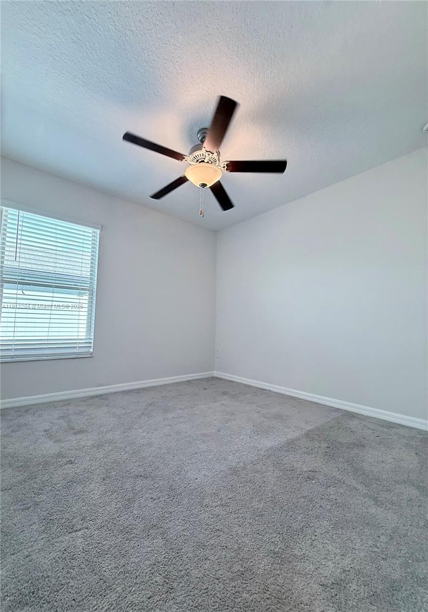 39889 Harmon Grove Court Zephyrhills, FL 33540 - Photo 20 of 55 a view of an empty room