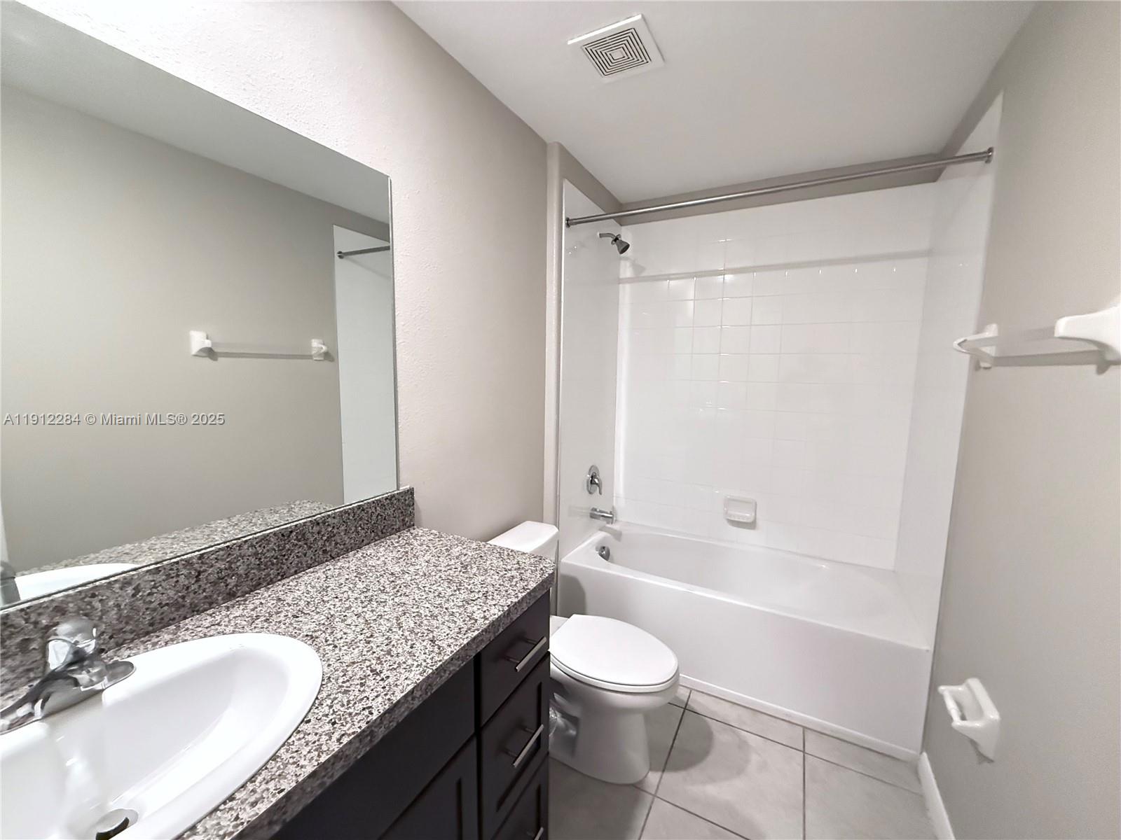 39889 Harmon Grove Court Zephyrhills, FL 33540 - Photo 22 of 55 a bathroom with a granite countertop sink toilet and shower