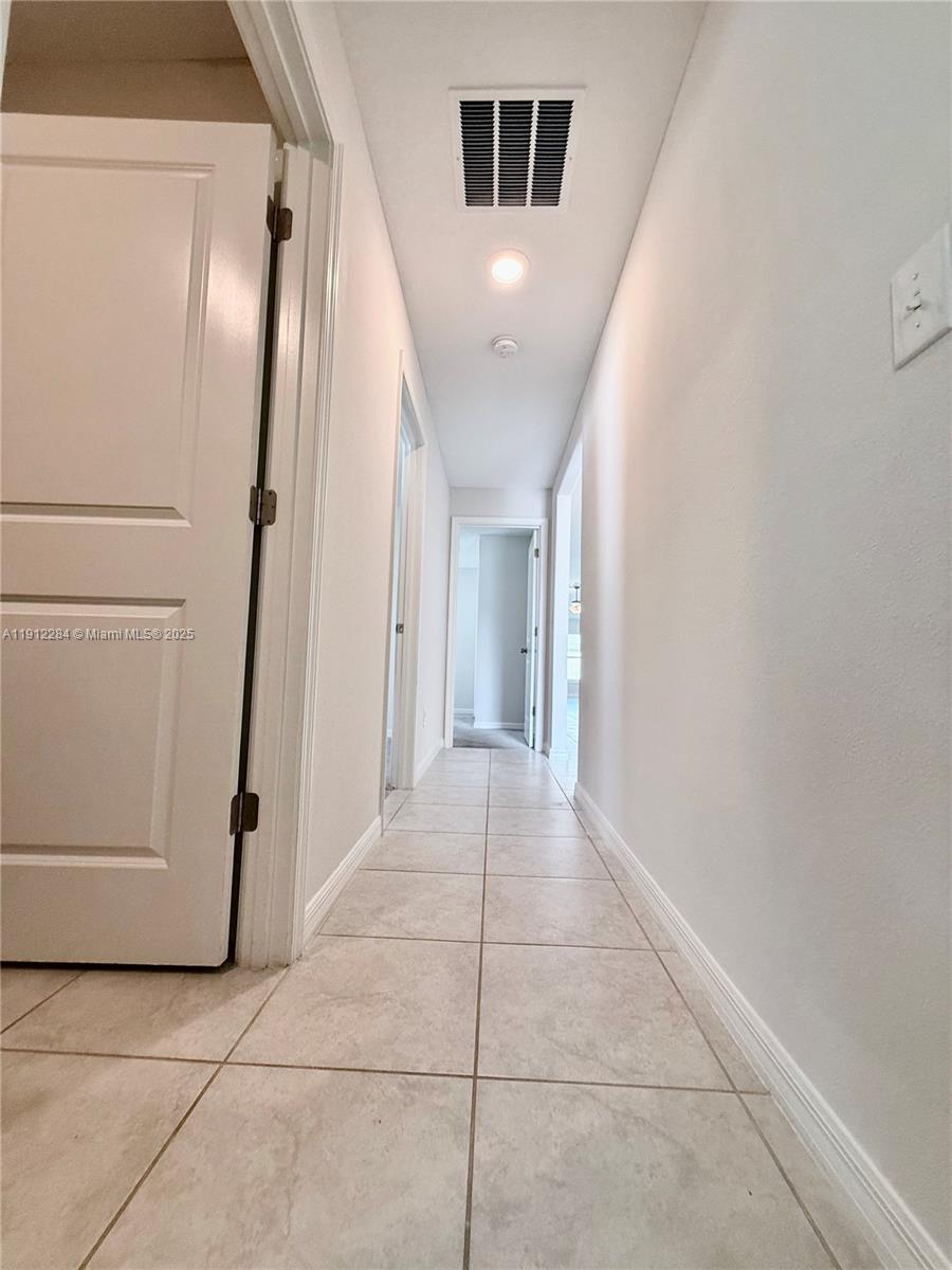 39889 Harmon Grove Court Zephyrhills, FL 33540 - Photo 24 of 55 a view of a hallway with staircase