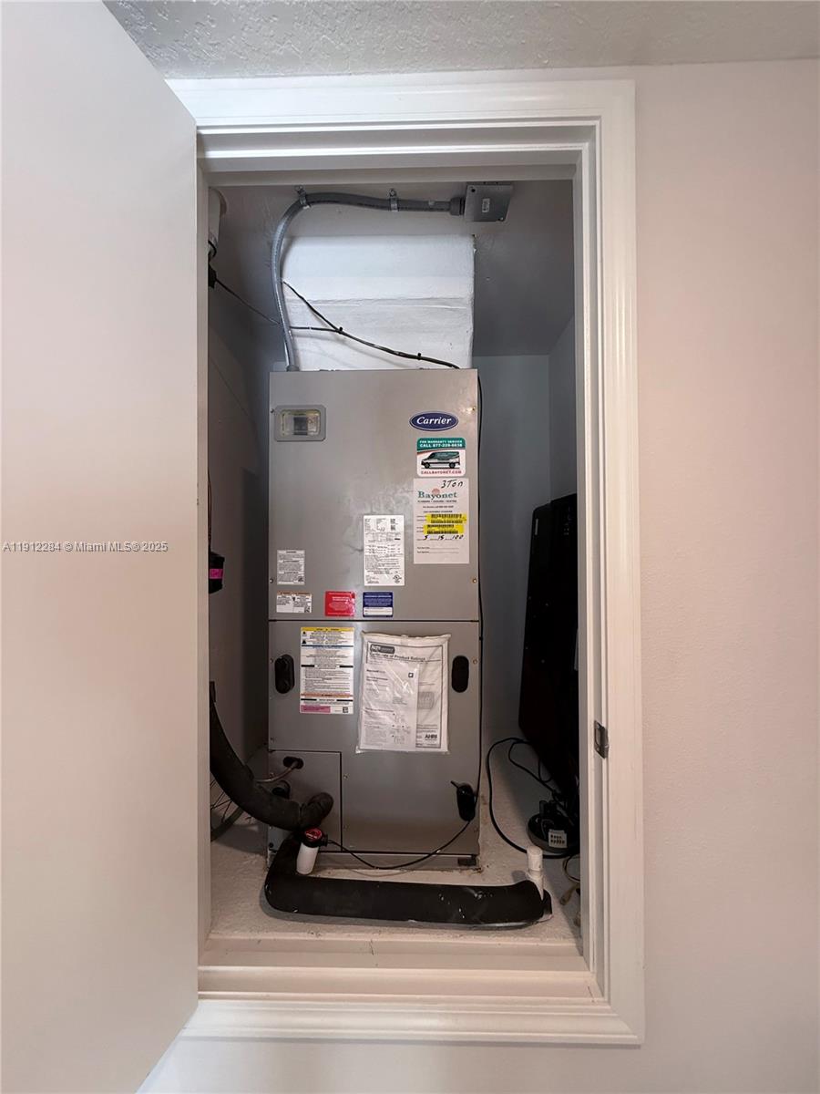 39889 Harmon Grove Court Zephyrhills, FL 33540 - Photo 32 of 55 a room with a mirror and gym equipment