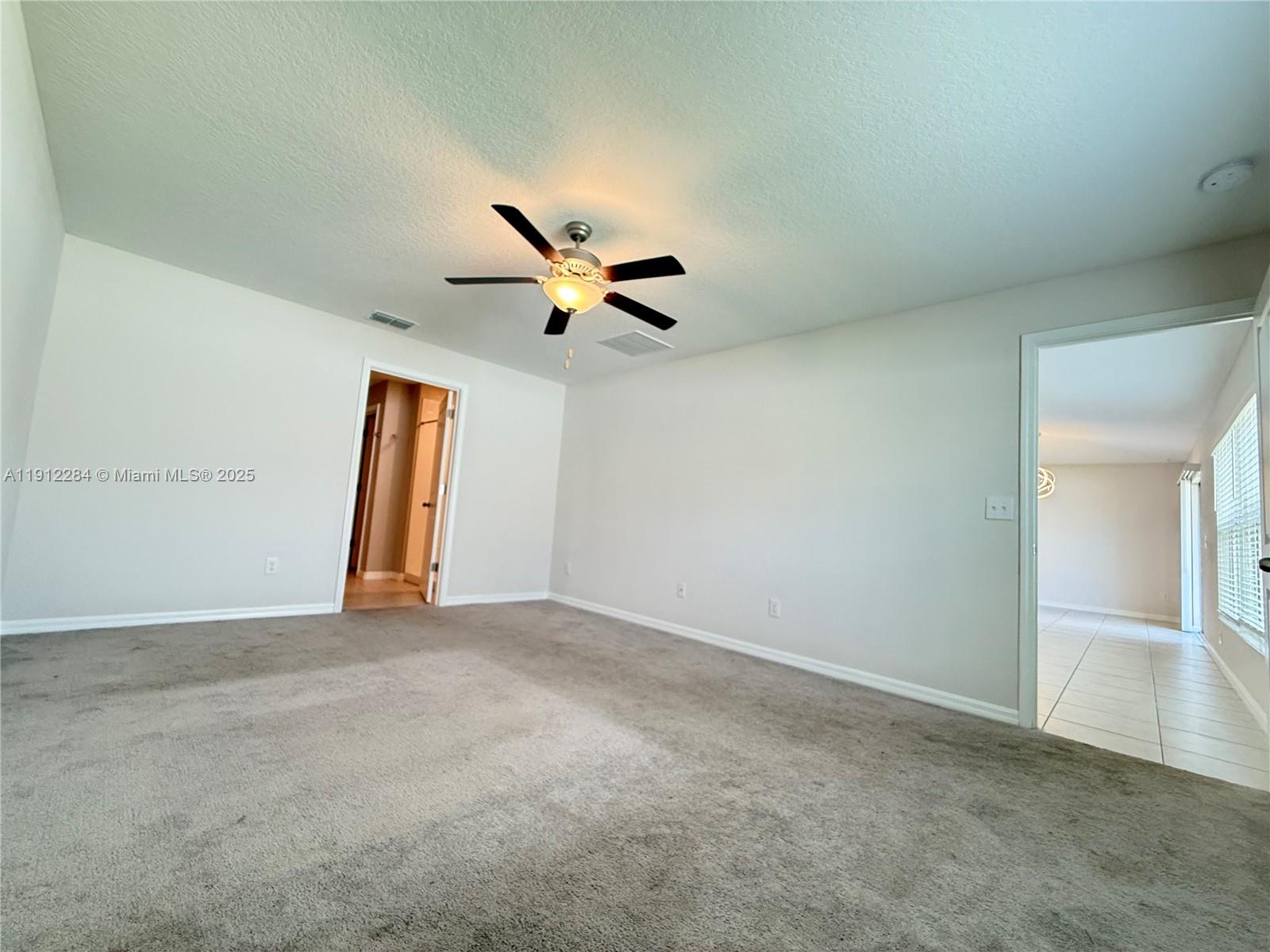 39889 Harmon Grove Court Zephyrhills, FL 33540 - Photo 39 of 55 an empty room with closet and windows
