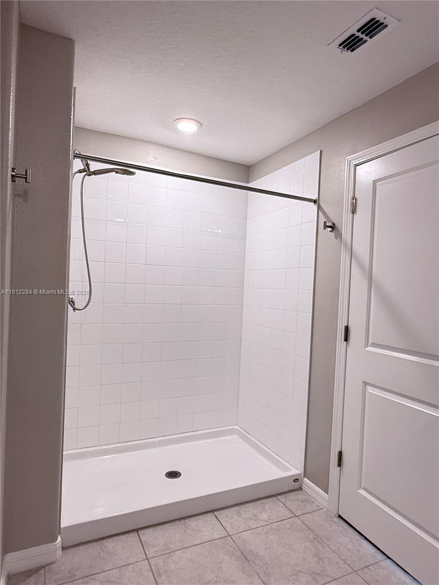 39889 Harmon Grove Court Zephyrhills, FL 33540 - Photo 40 of 55 a bathroom with a shower