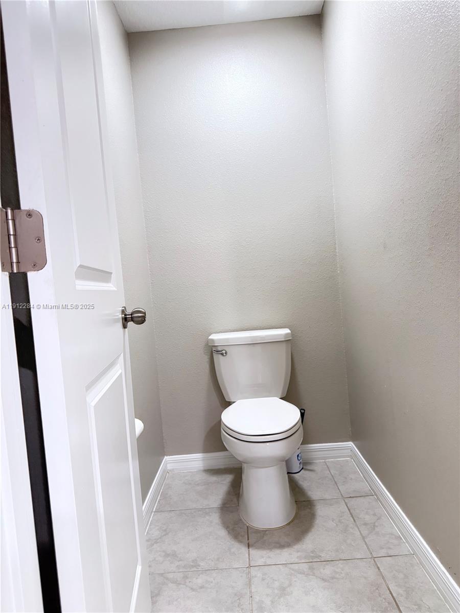 39889 Harmon Grove Court Zephyrhills, FL 33540 - Photo 41 of 55 a white toilet sitting next to a sink
