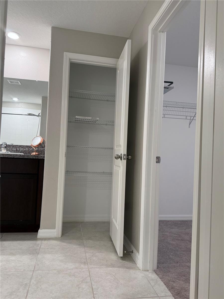 39889 Harmon Grove Court Zephyrhills, FL 33540 - Photo 45 of 55 a view of a bathroom with a sink and a mirror