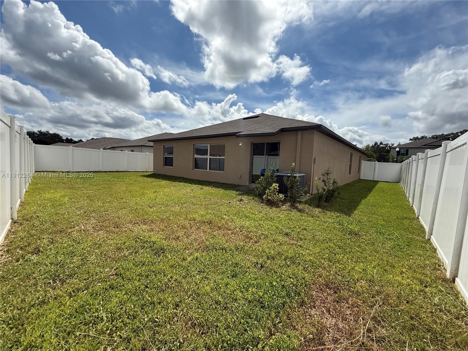 39889 Harmon Grove Court Zephyrhills, FL 33540 - Photo 51 of 55 a view of a house with a backyard