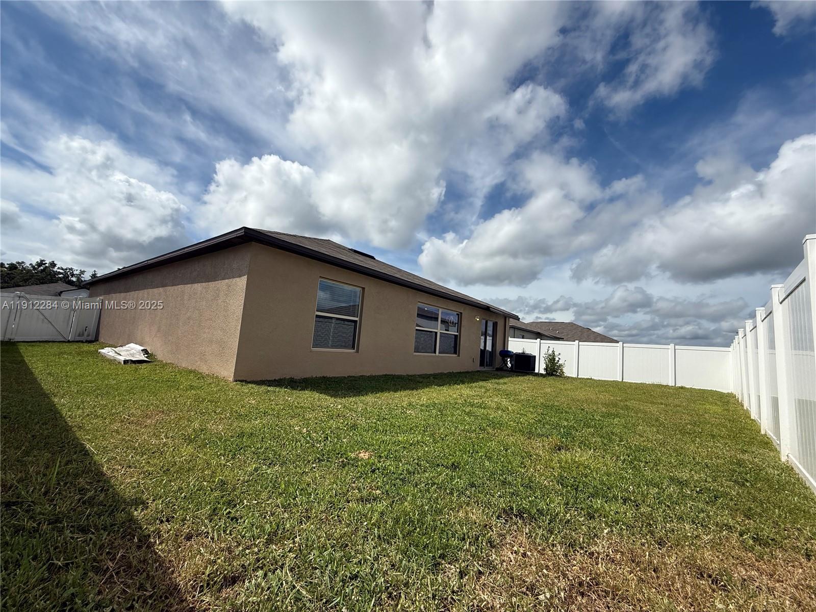 39889 Harmon Grove Court Zephyrhills, FL 33540 - Photo 55 of 55 a house with a big yard