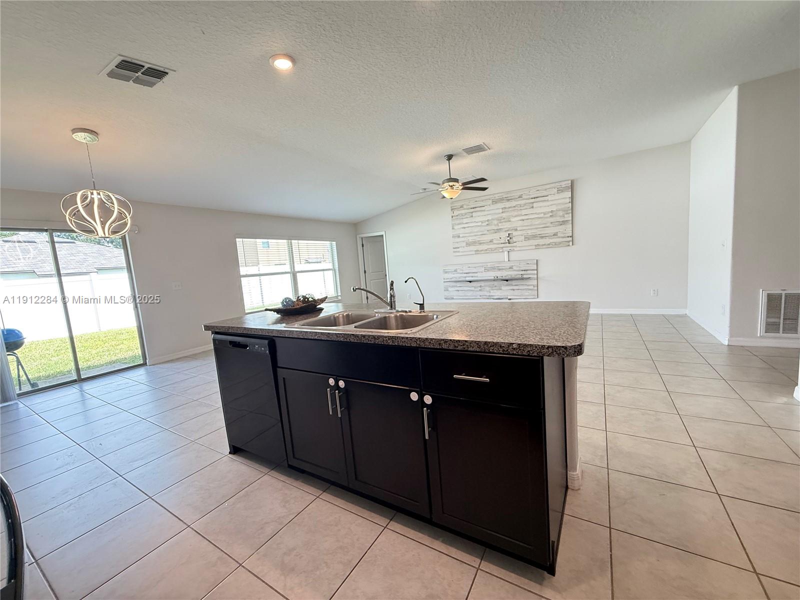 39889 Harmon Grove Court Zephyrhills, FL 33540 - Photo 7 of 55 a bathroom with a sink vanity and mirror