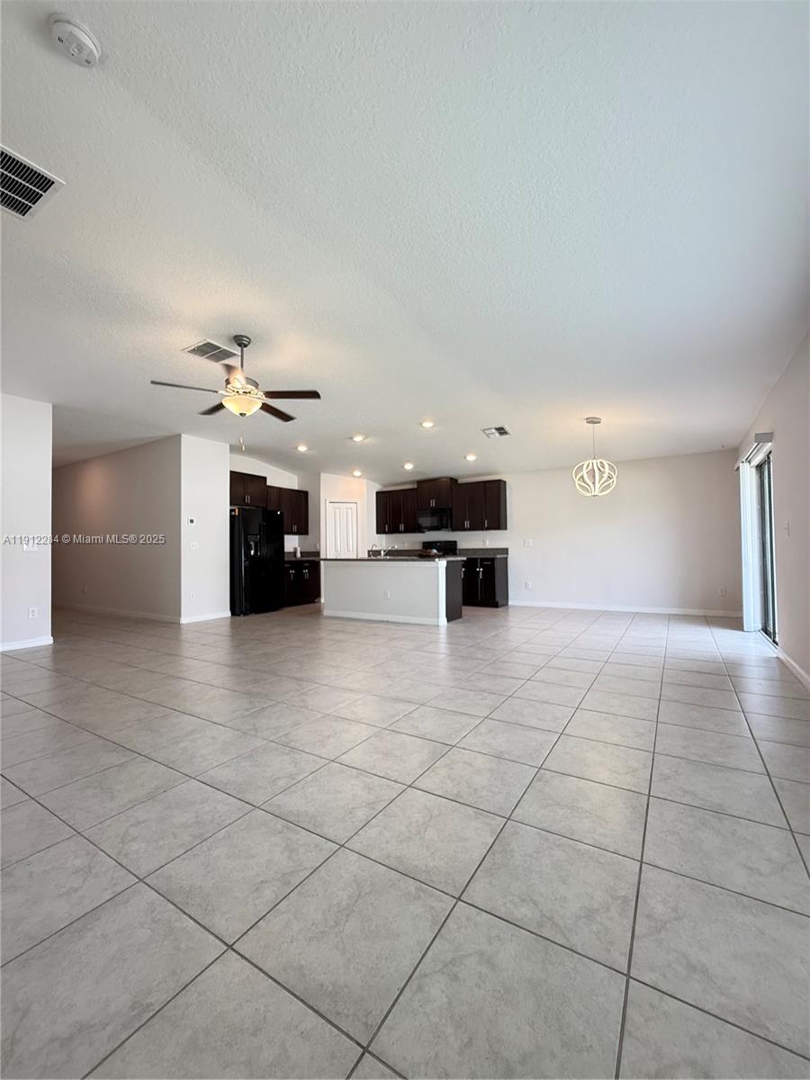 39889 Harmon Grove Court Zephyrhills, FL 33540 - Photo 10 of 55 a view of kitchen with furniture and a stove