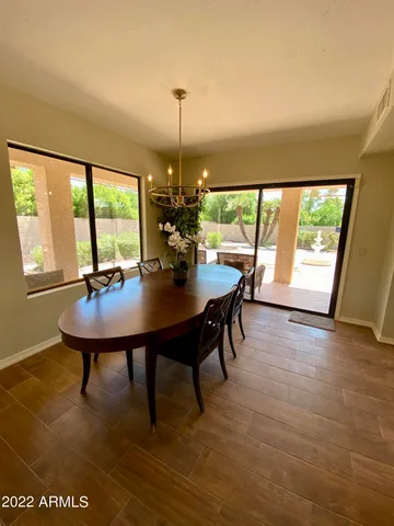 a view of a dining room with furniture and window