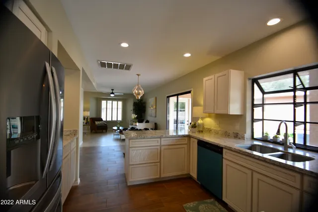 a kitchen with sink cabinets and window
