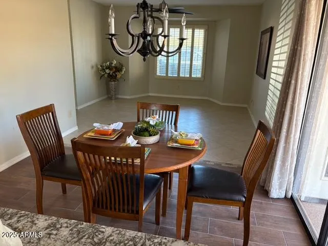 a view of a dining room with furniture and window