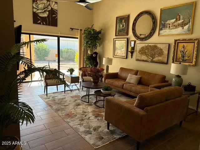 a living room with furniture and a large window