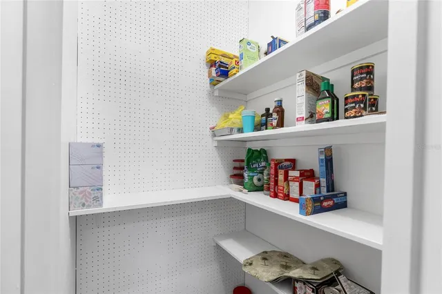 a shelf with books and knick knacks on it