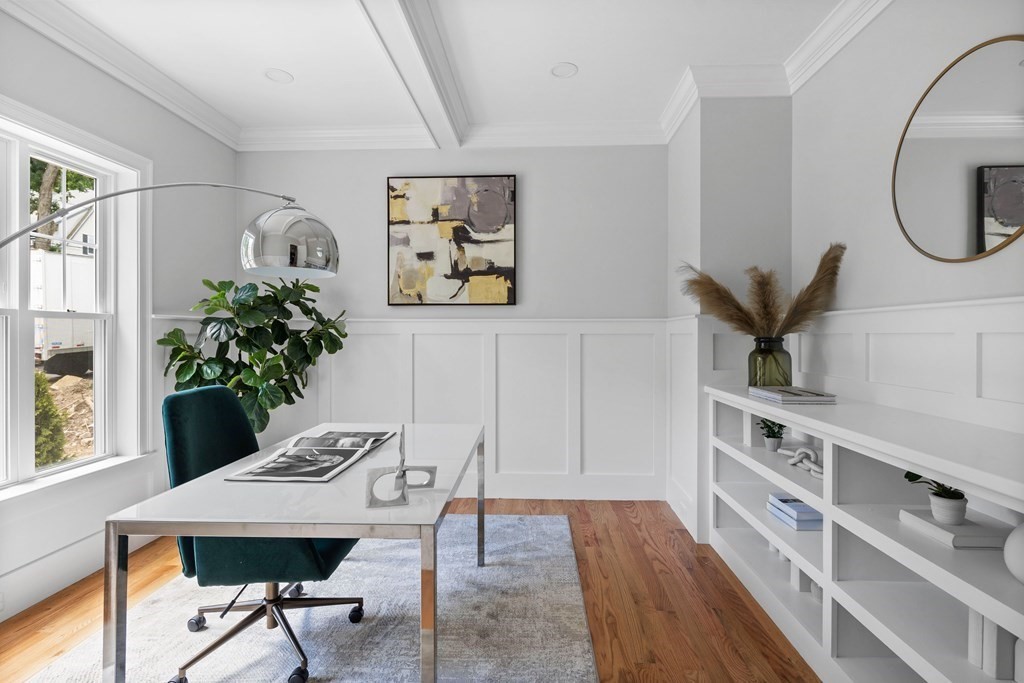 31 Kenilworth Road Arlington, MA 02476 - Photo 15 of 41 a view of a room that has a table and a potted plant