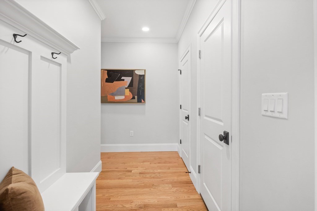 31 Kenilworth Road Arlington, MA 02476 - Photo 16 of 41 a view of a hallway with wooden floor and closet