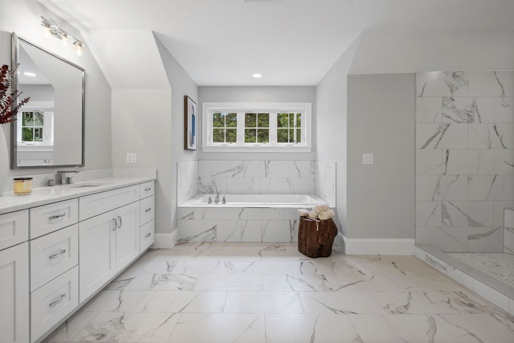 31 Kenilworth Road Arlington, MA 02476 - Photo 23 of 41 a bathroom with a tub sink and mirror