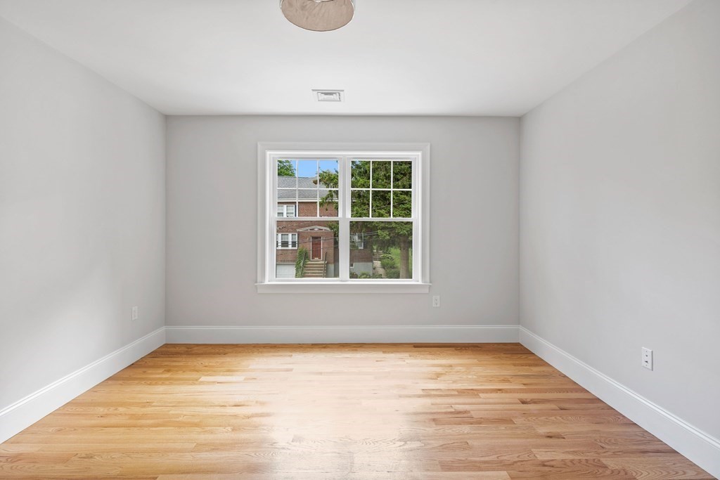 31 Kenilworth Road Arlington, MA 02476 - Photo 27 of 41 a view of empty room with wooden floor and fan